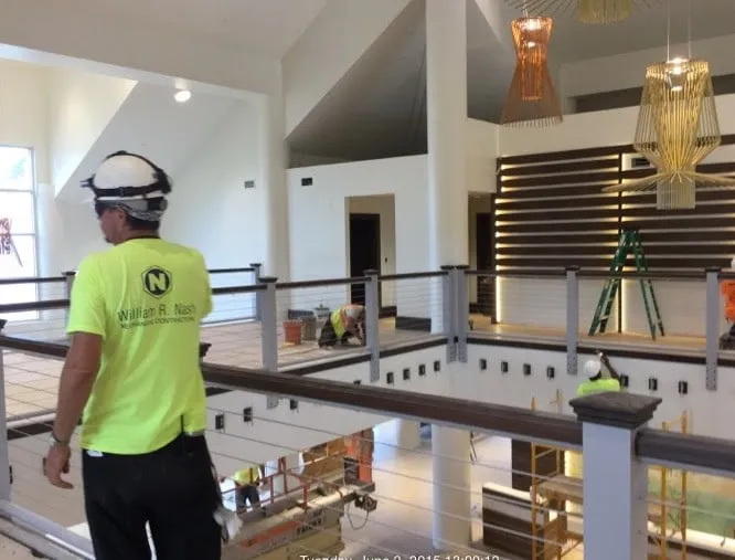 A Stabilis superintendent on the walkway inside the atrium during the renovation