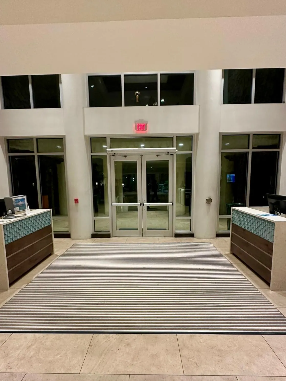 The resort's main entrance, its glazed doors and the full-height glass either side of them