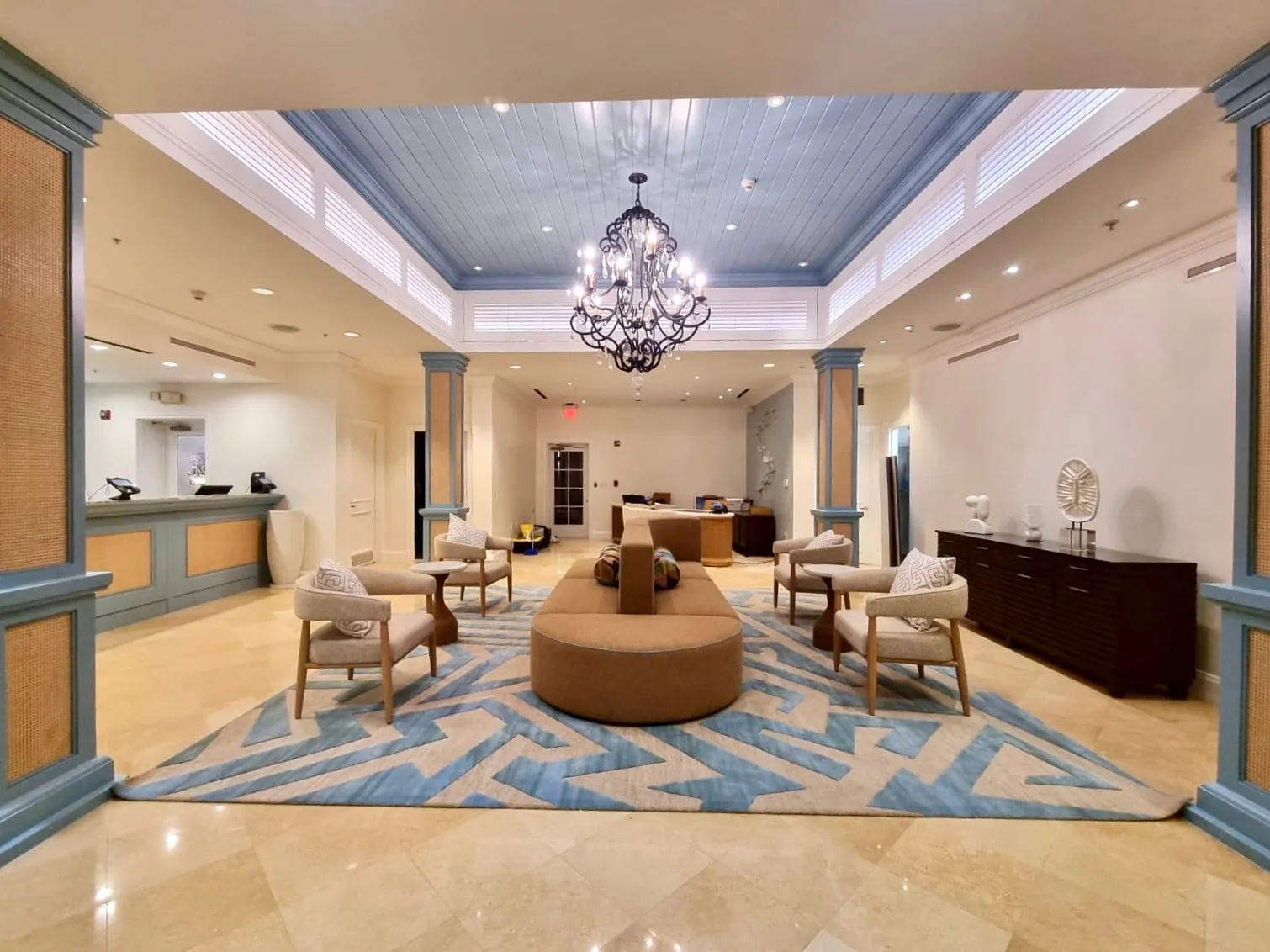 The renovated lobby looking towards reception, new rug, seating and lighting in place