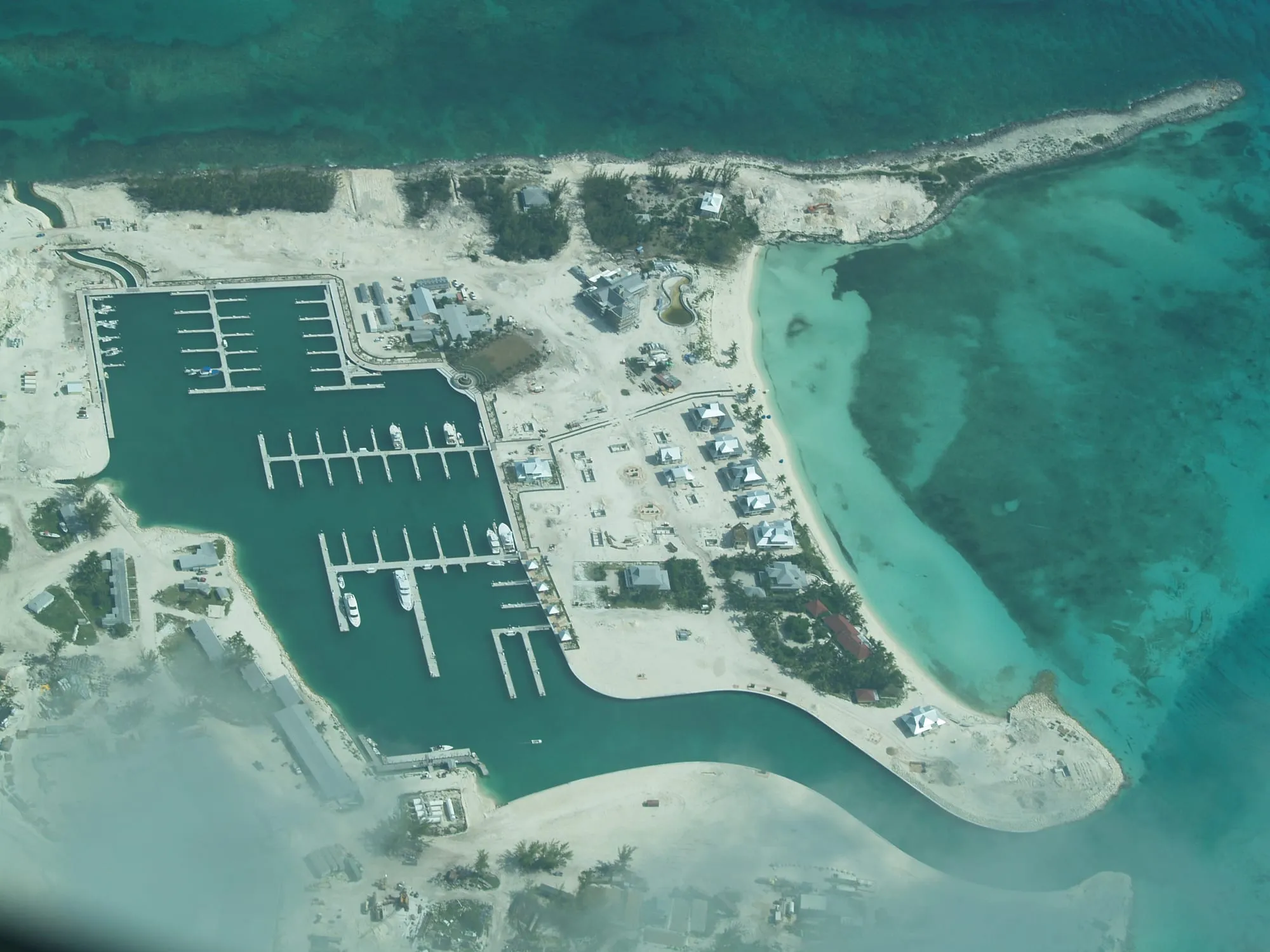 Aerial view of the finished marina, its docks and the sandbar beyond