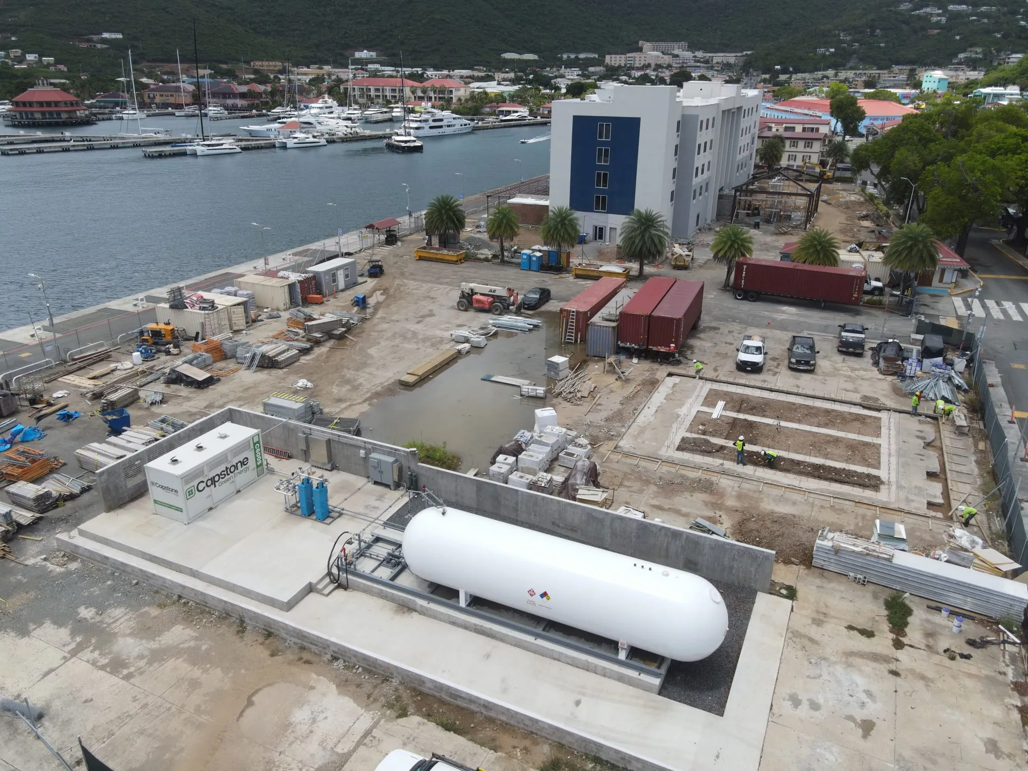 Aerial view of the hotel site beside the harbour, with the LPG tank and equipment pads laid out